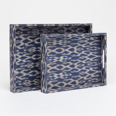 Two woven raffia tinalak trays displayed against a neutral background The larger tray on the left is blue with a geometric pattern