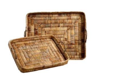 Two woven rattan trays, one large and one small, with a natural, wicker texture, displayed against a plain background.