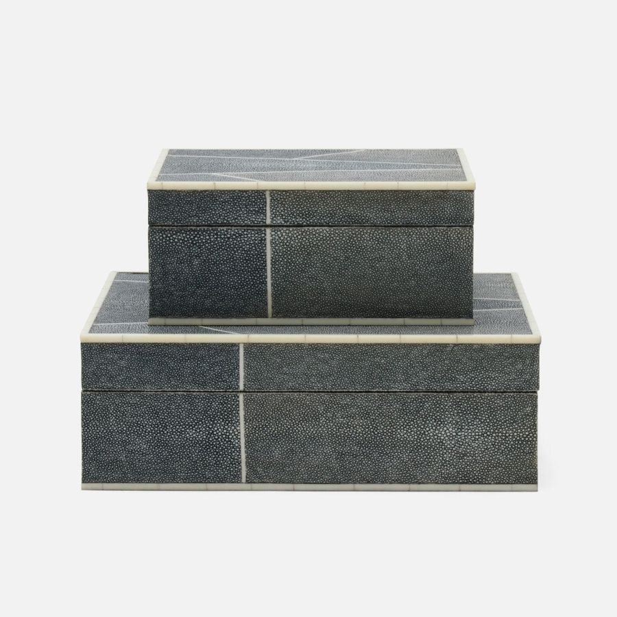 Three-tiered faux shagreen brick boxes in geometric patterns, cool grey, sand, mixed navy, and mushroom colors.