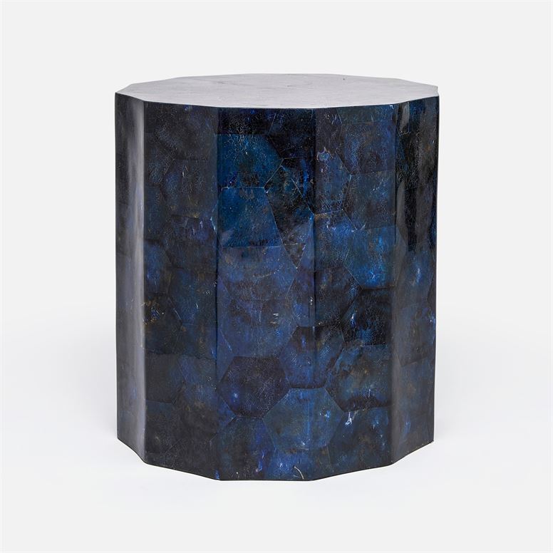 Dark blue faceted side table with unique pattern and coloration.