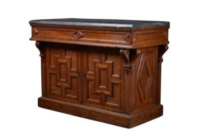 Antique English Oak Buffet with Marble Top featuring two drawers accessible from either side circa 1920s This piece showcases a rich dark