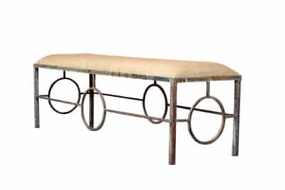 Aged Rustic Metal Circle Base Bench with Upholstered Seat and Decorative Circles on Base