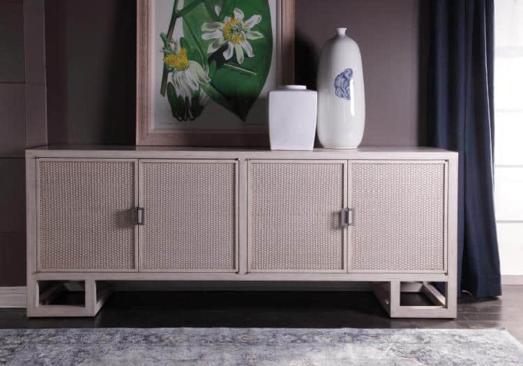 Woven Cane Buffet with four doors and interior shelves, featuring a pewter finish and hardwear, set against a dark background.