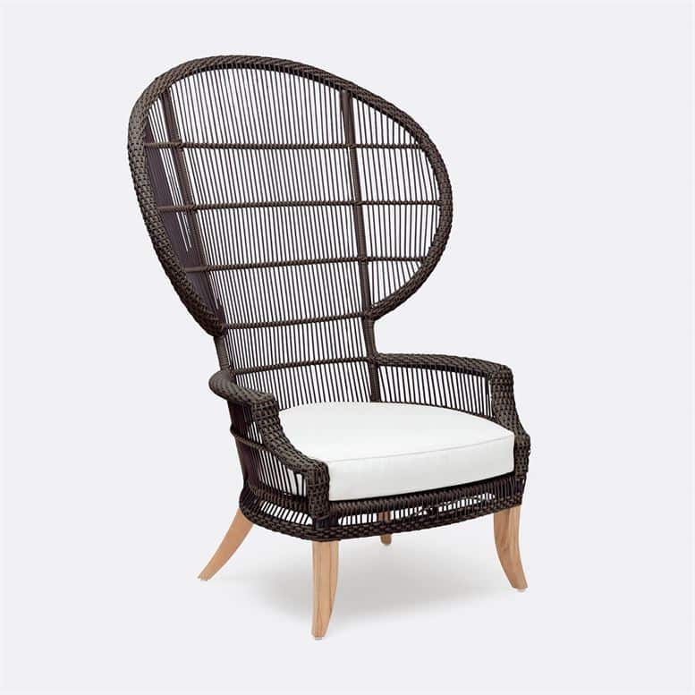 An outdoor wicker chair with a cushioned seat and teak legs, designed for comfort and durability.