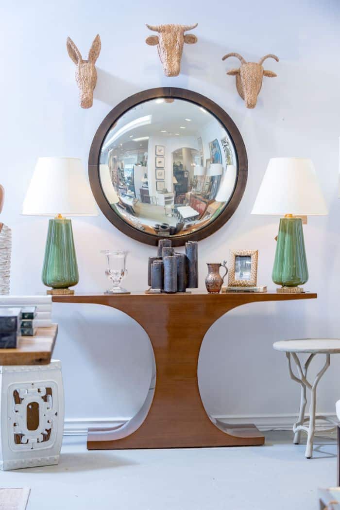 The image showcases a Colbert Antique Brass Convex Mirror with a 2 frame set against a white wall The mirror s brass