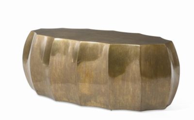 The image shows a contemporary scalloped antiqued brass oval coffee table.