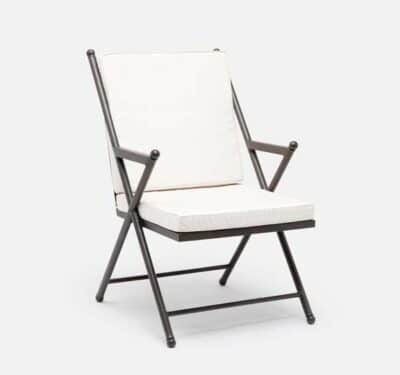 Outdoor camp dining chair with white cushion and black frame, available in various fabric options.