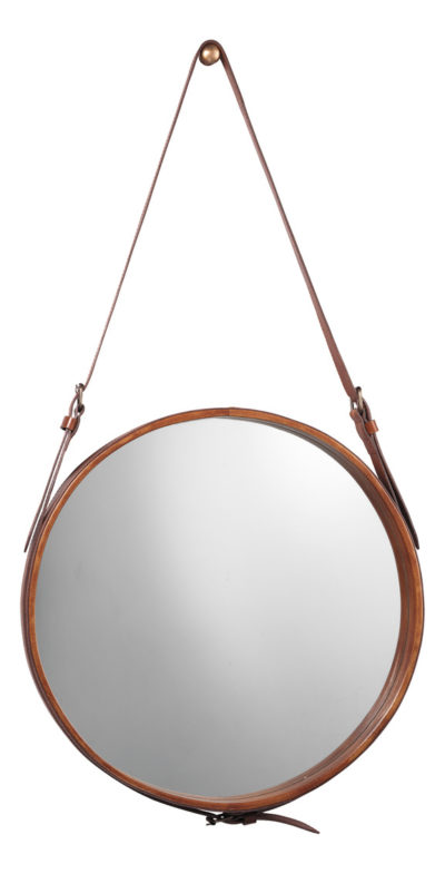 Large round mirror with a leather strap hanging from a decorative brass knob.