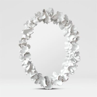 Oval mirror in faux white coral frame with silver detail.