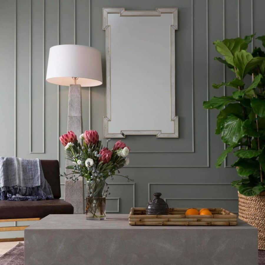 Antiqued mirror on wall in elegant living room setting