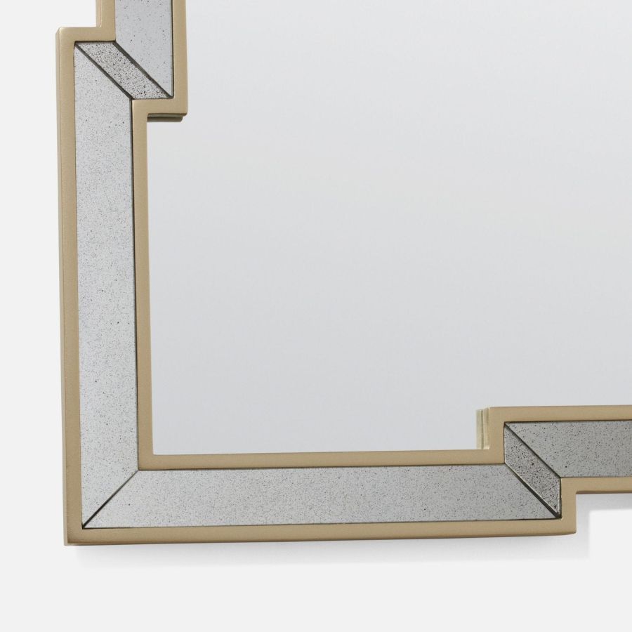 Close-up of Nadine Mirror featuring an ornate, antiqued frame with intricate cut panels.