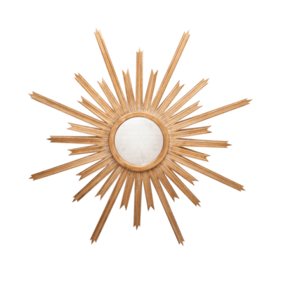 Starburst mirror with gold leaf on hand carved wooden frame, set against a green background.