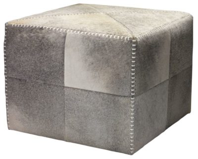 A large ottoman with a grey hide exterior, featuring whipstitch detailing on its sides and top, set against a white background.