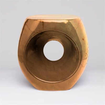 Brown ceramic stool with a high shine finish, either in metallic charcoal or crackled gold glaze, set against a neutral background.