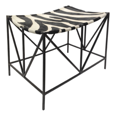 Darius iron framed stool with zebra print hide seat. Black frame, faux zebra pattern on seat. Two variations available in Houston.