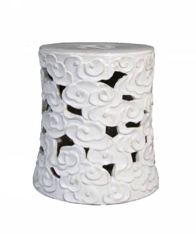 Concave white ceramic stool with decorative floral swirl design each piece varies in color and glaze pitting and small imperfections are part