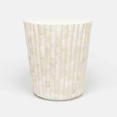 Round white marble side table with scalloped edge and polished finish.