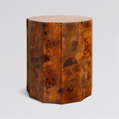 Brown faceted side table with a patterned surface and a modern design.