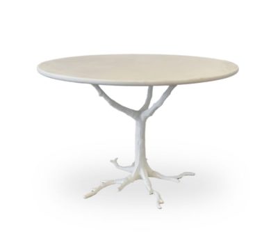White faux bois marble and iron table with a naturalistic base and a smooth marble top showcasing its elegant design as a