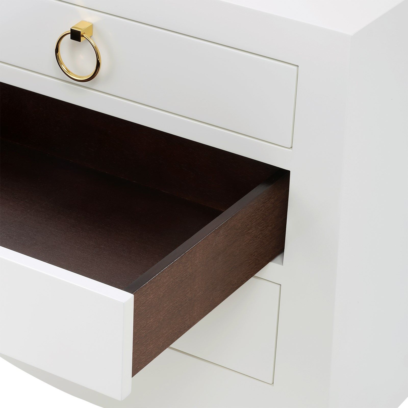 White lacquered nightstand with three drawers, stained interior and antiqued gold pull.