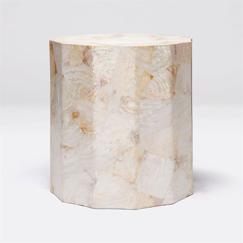A faceted young penshell side table with a unique pattern and coloration, showcasing its natural material texture and design.