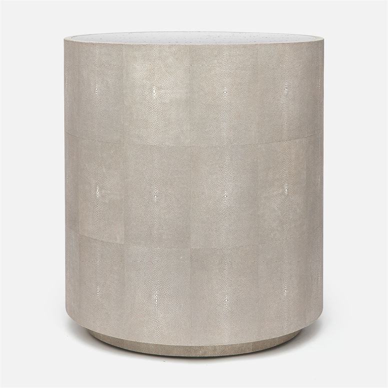A round, modern side table with a metallic grey or silver faux shagreen top and mirrored finish.