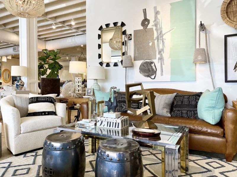The image displays an interior setting with a contemporary style featuring modern furniture and decorative items At the center is a large
