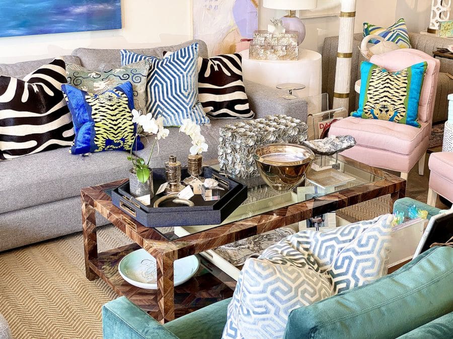 Banana bark coffee table with geometric pattern, dark stain and glass top.