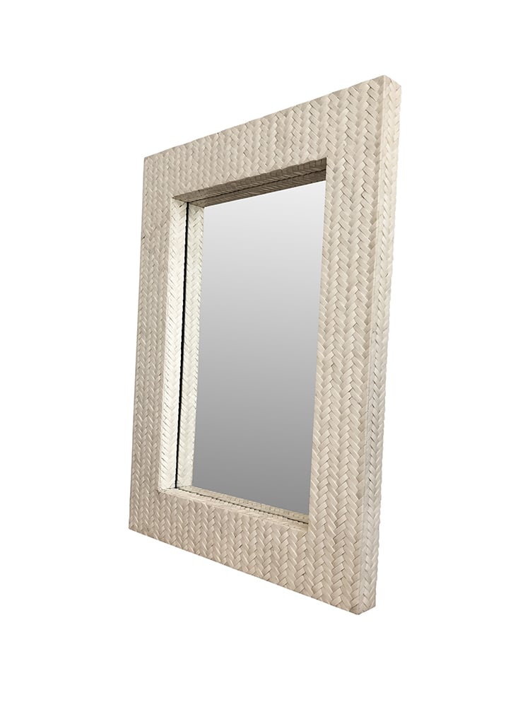 A wall mirror with a woven basket frame and bone coloring.