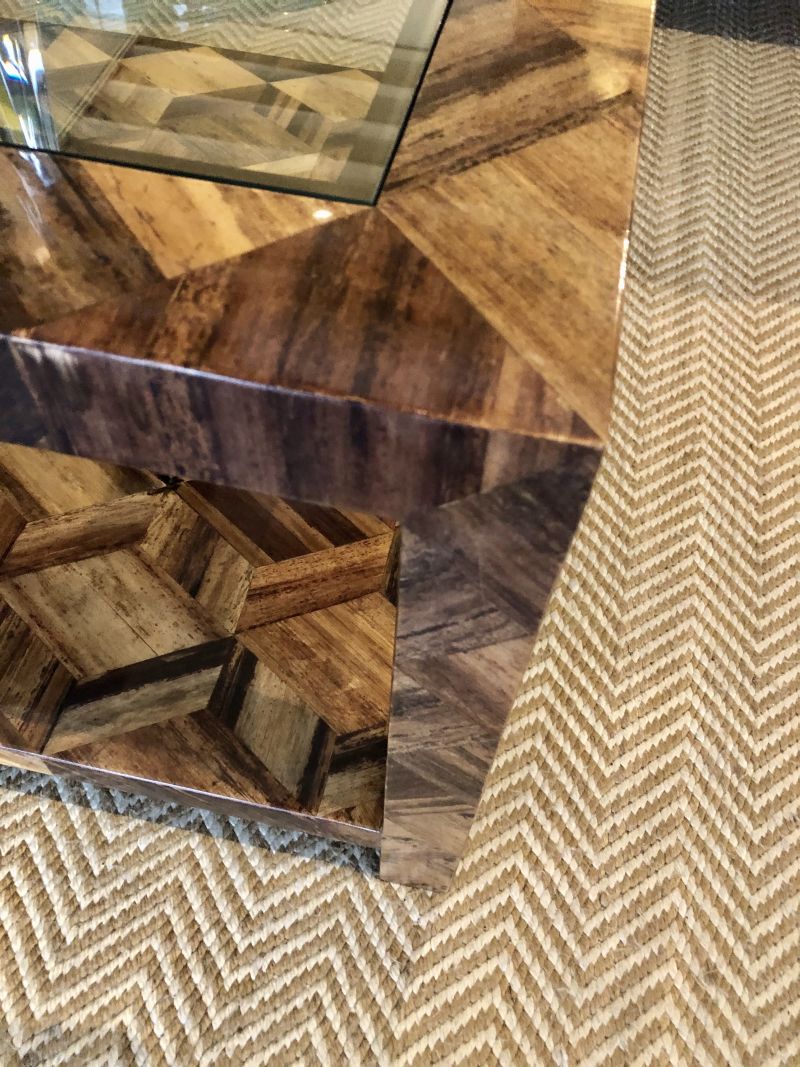 Banana bark coffee table with glass top and geometric bark pattern available in dark stain or natural banana bark crafted by hand