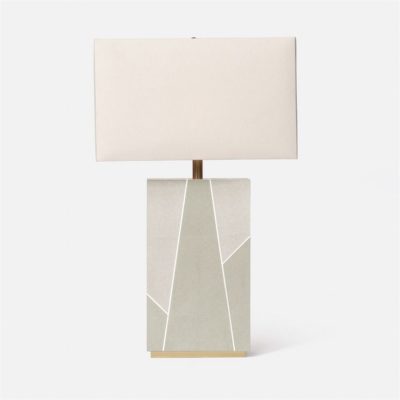 A modern table lamp with a geometric design, featuring a beige shade and a wooden base with a geometric pattern.