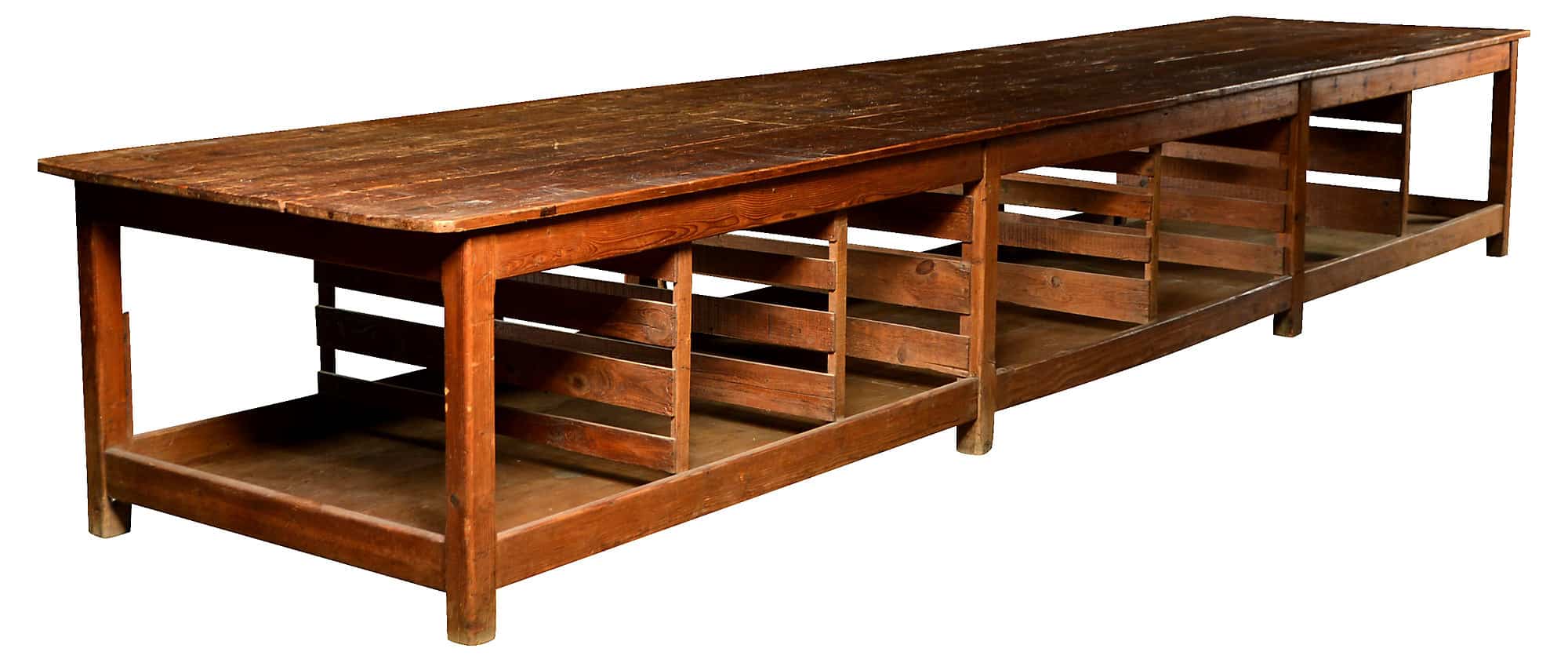 Wooden antique factory work table with shelves, used for cutting cloth in Hasselt, Belgium.
