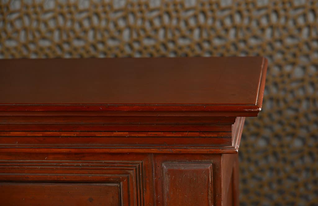 Wooden buffet with two removable interior shelves per door and two slim upper drawers with small ring pulls displayed at an angle