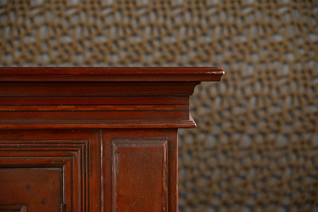 Dark brown wooden buffet with a light wood inlay design featuring two removable interior shelves per door and two slim upper drawers