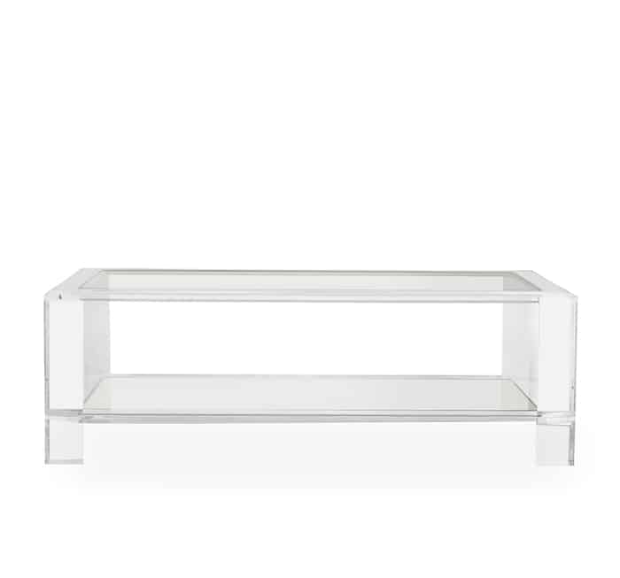 Clear acrylic coffee table with a rectangular glass shelf and top, set against a white background.