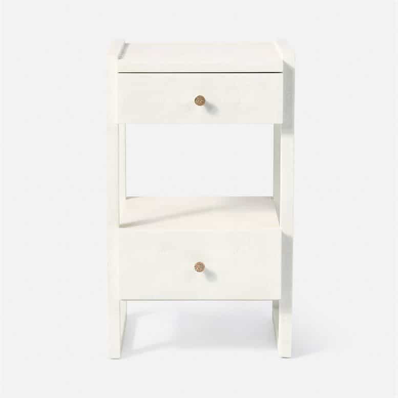 A white nightstand with a single drawer and a shelf beneath it, set against a plain background.