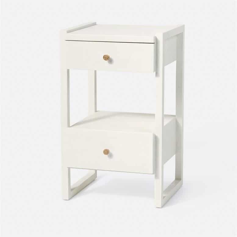White nightstand with two shelves and a drawer, set against a white background.