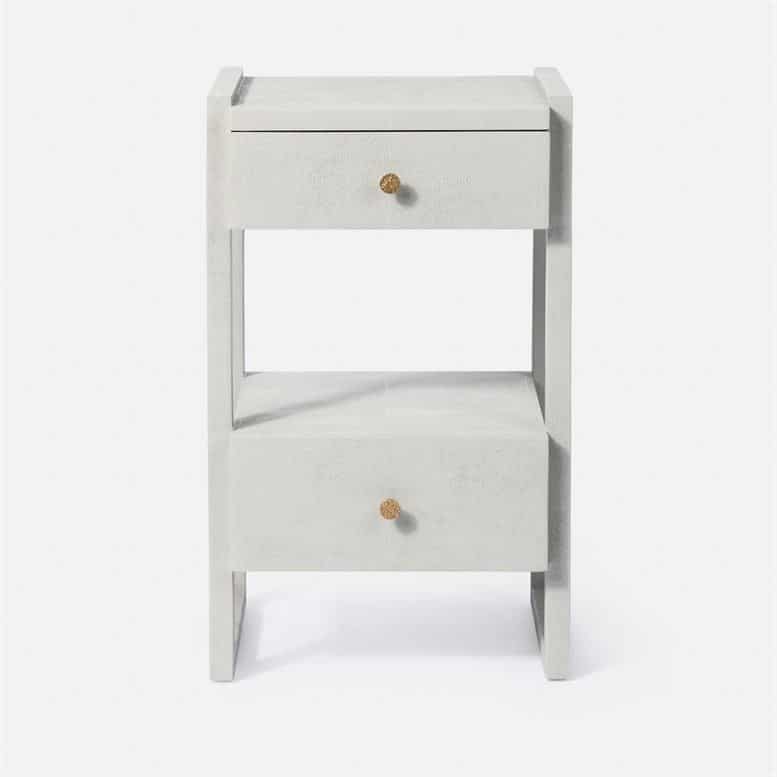 A large modern nightstand with a two-tiered design featuring a smooth white finish and a single visible drawer pull The nightstand is