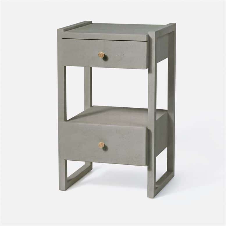 A tall, modern nightstand with a metallic finish, featuring two shelves and a drawer.