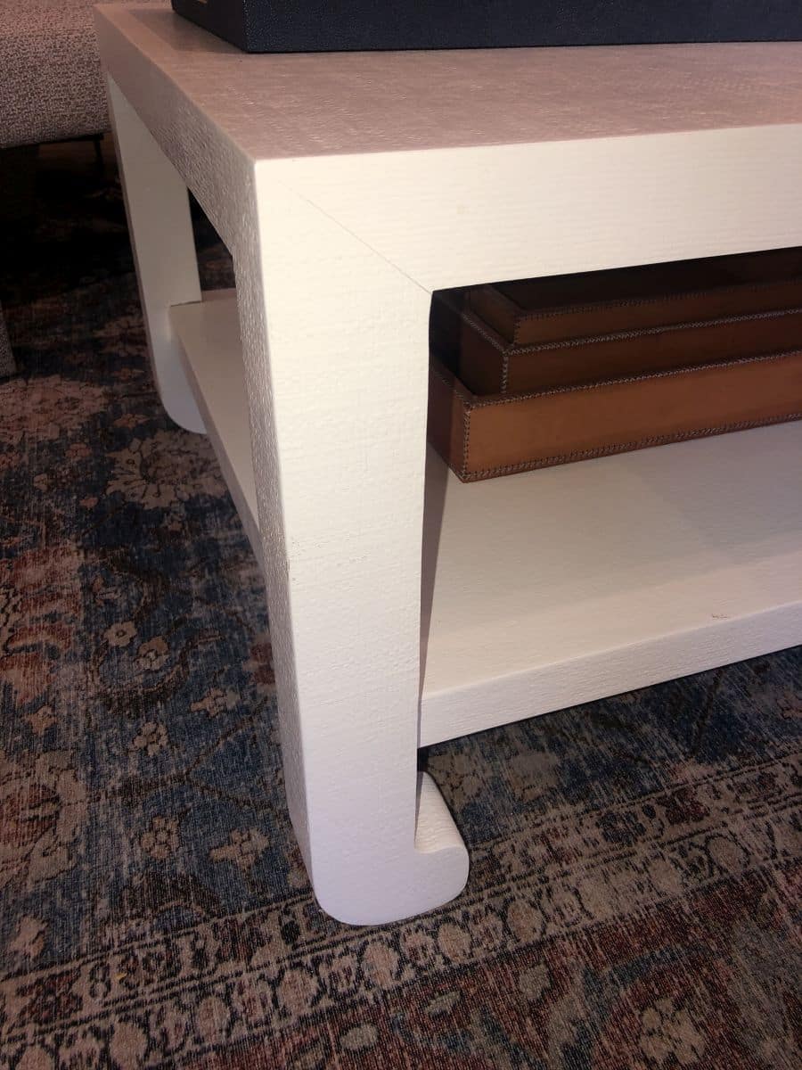 Ming Style Faux Raffia Coffee Table on display, available in French Gray, Pristine or Seal French Gray.