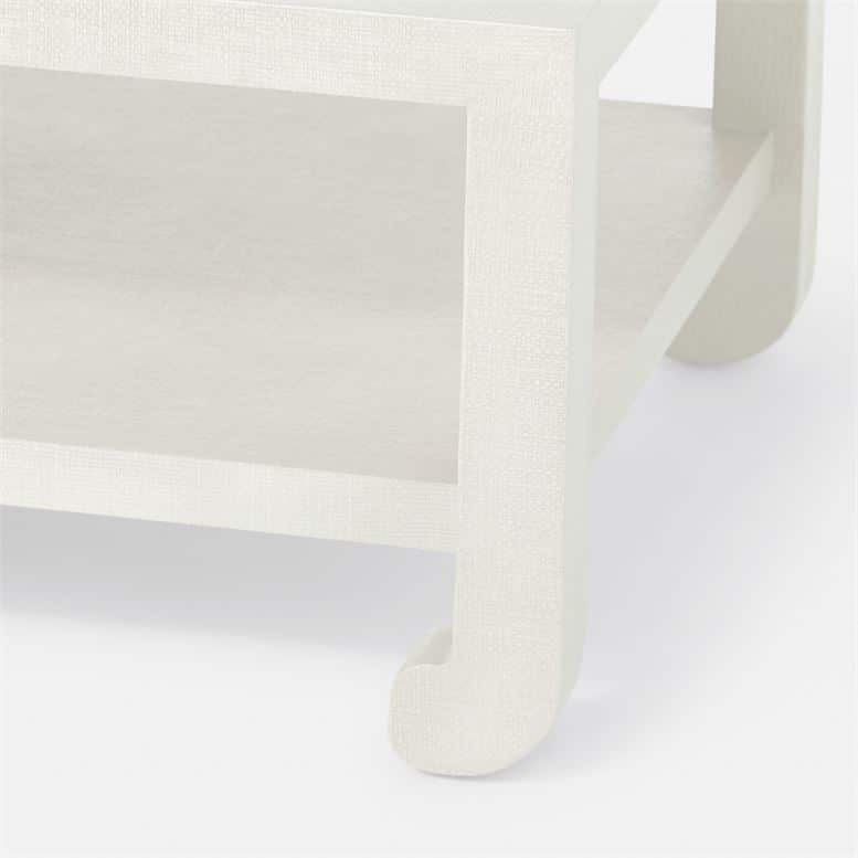 A sleek, modern white coffee table with a faux raffia finish.