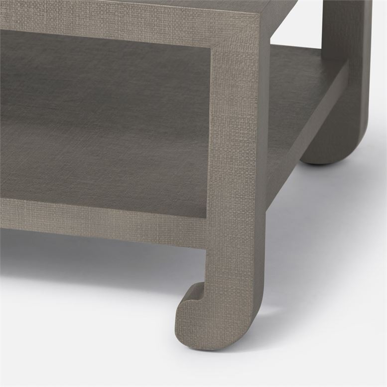 A modern coffee table with a faux raffia finish, available in French Gray and Pristine or Seal French Gray.