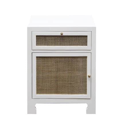 Small white lacquered front cabinet with a single door and top drawer, set against a neutral background.