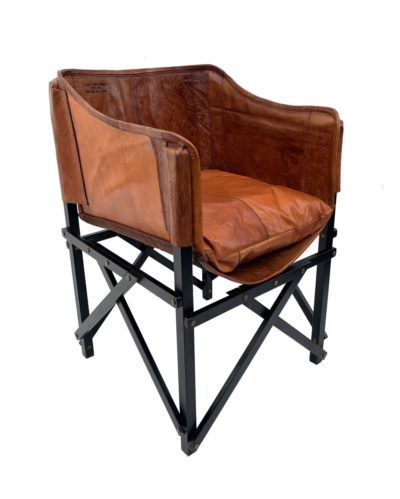 A brown leather Paris cafe chair with a teak frame, stained dark, and a loose cushion.