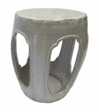 Rustic glazed ceramic garden stool featuring a unique hand-fired and hand-glazed texture with pitting and small imperfections available in rustic white green