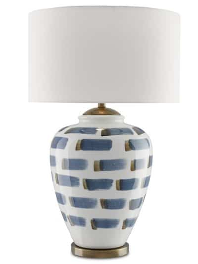 Table lamp with blue and brown striped shade and brass hardware.