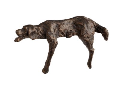 A sculpture of a sleeping dog in black bronze finish, displayed against a white background.