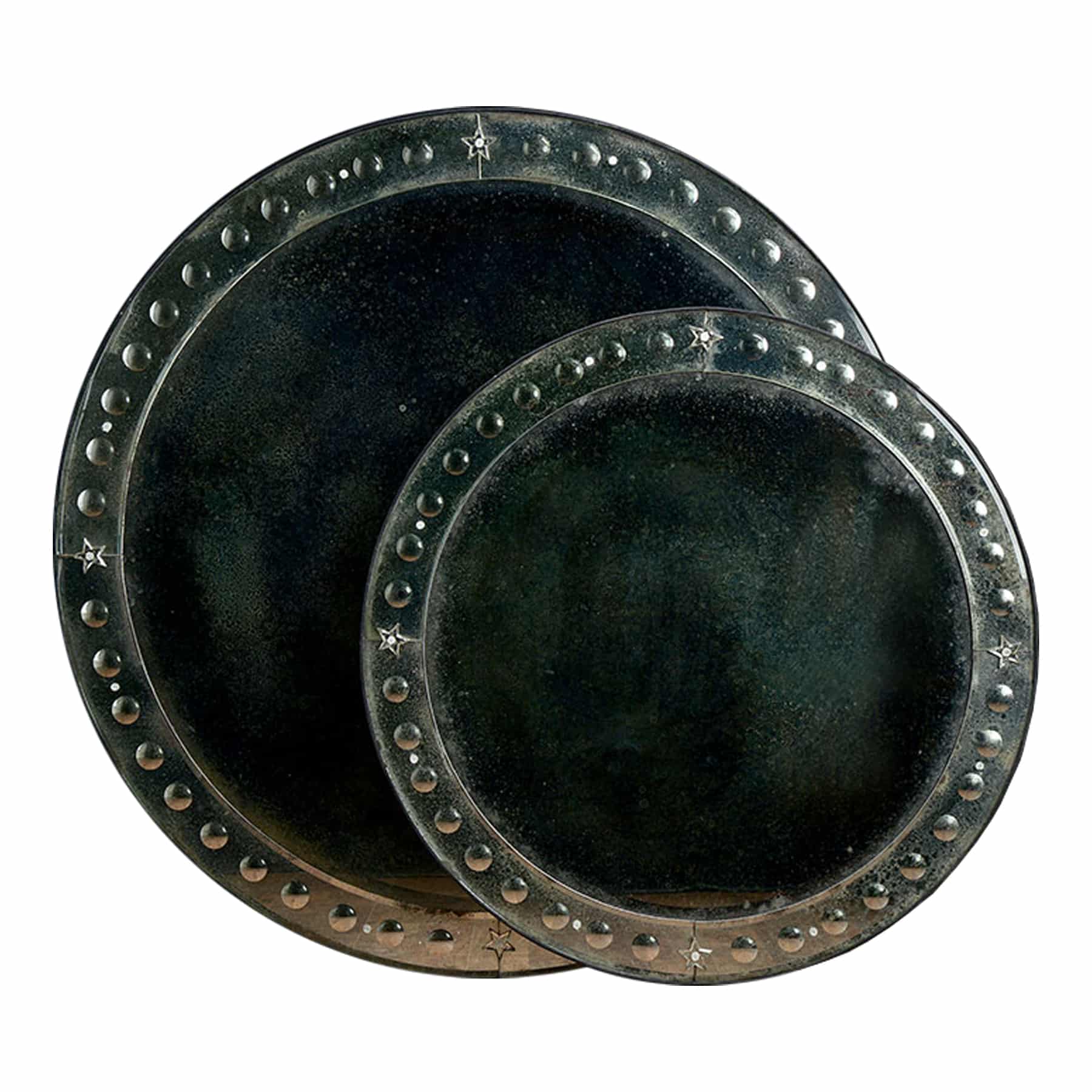 Three round antiqued Venetian bubble frame mirrors stacked together.