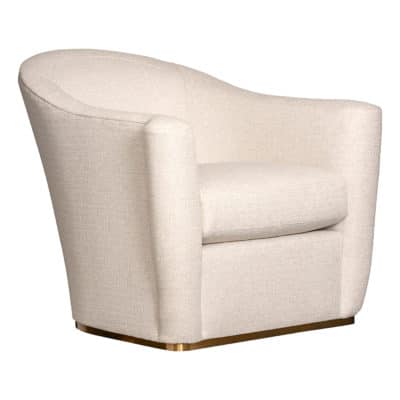 A cream-colored upholstered swivel chair with a brass base, set against a white background.