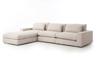 Blaine sectional sofa with ottoman featuring a natural fabric upholstery and floating ottoman portion for easy movement available in left or right